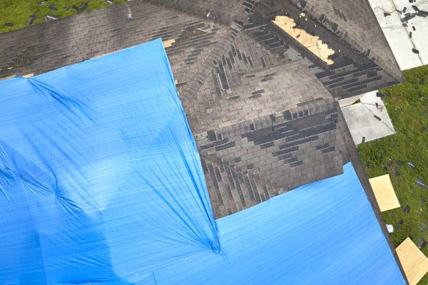 Storm Damage Roof Tarping in Easthampton